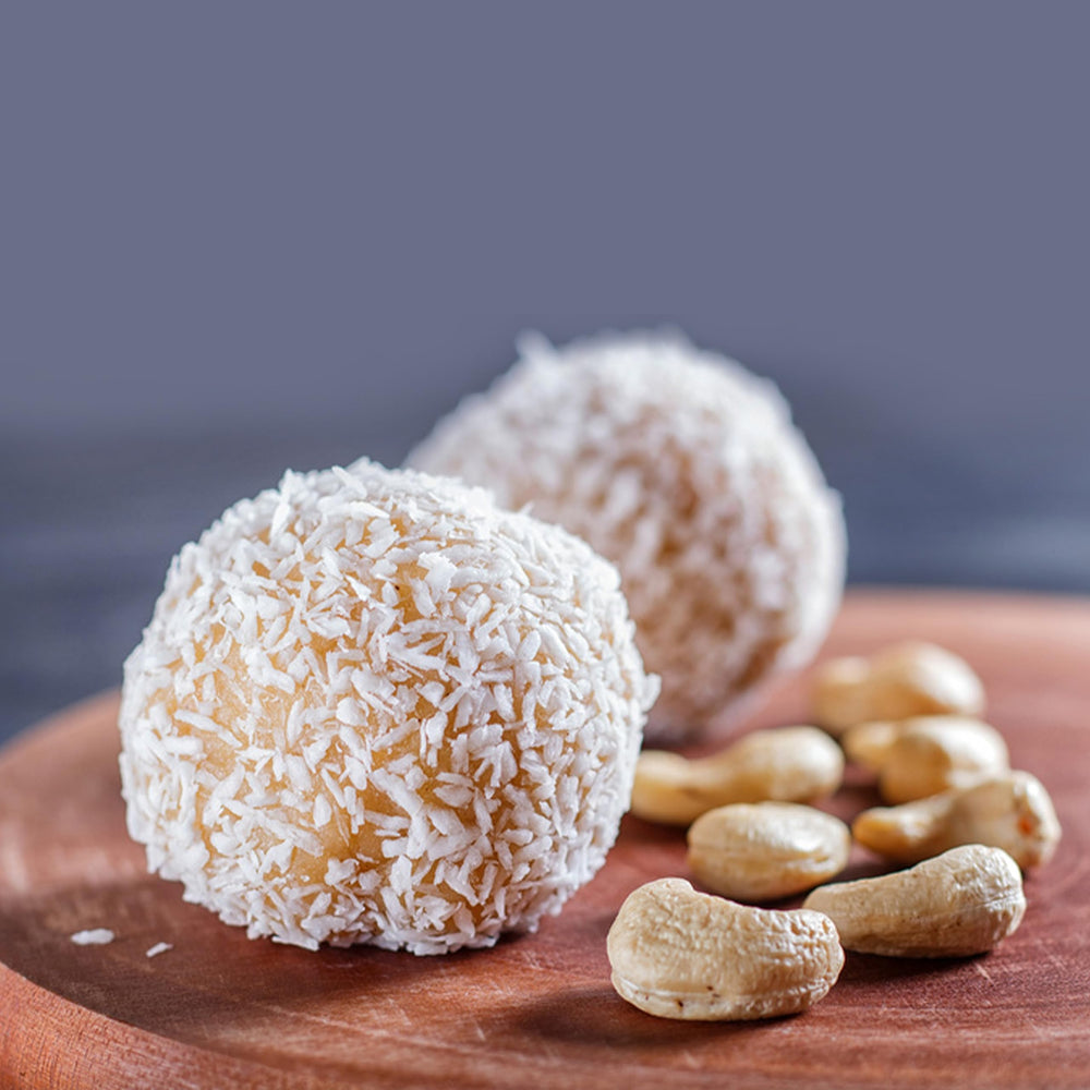Elan Coconut Cashews coating detail, crisp texture and tropical aroma for enjoyable snacking.