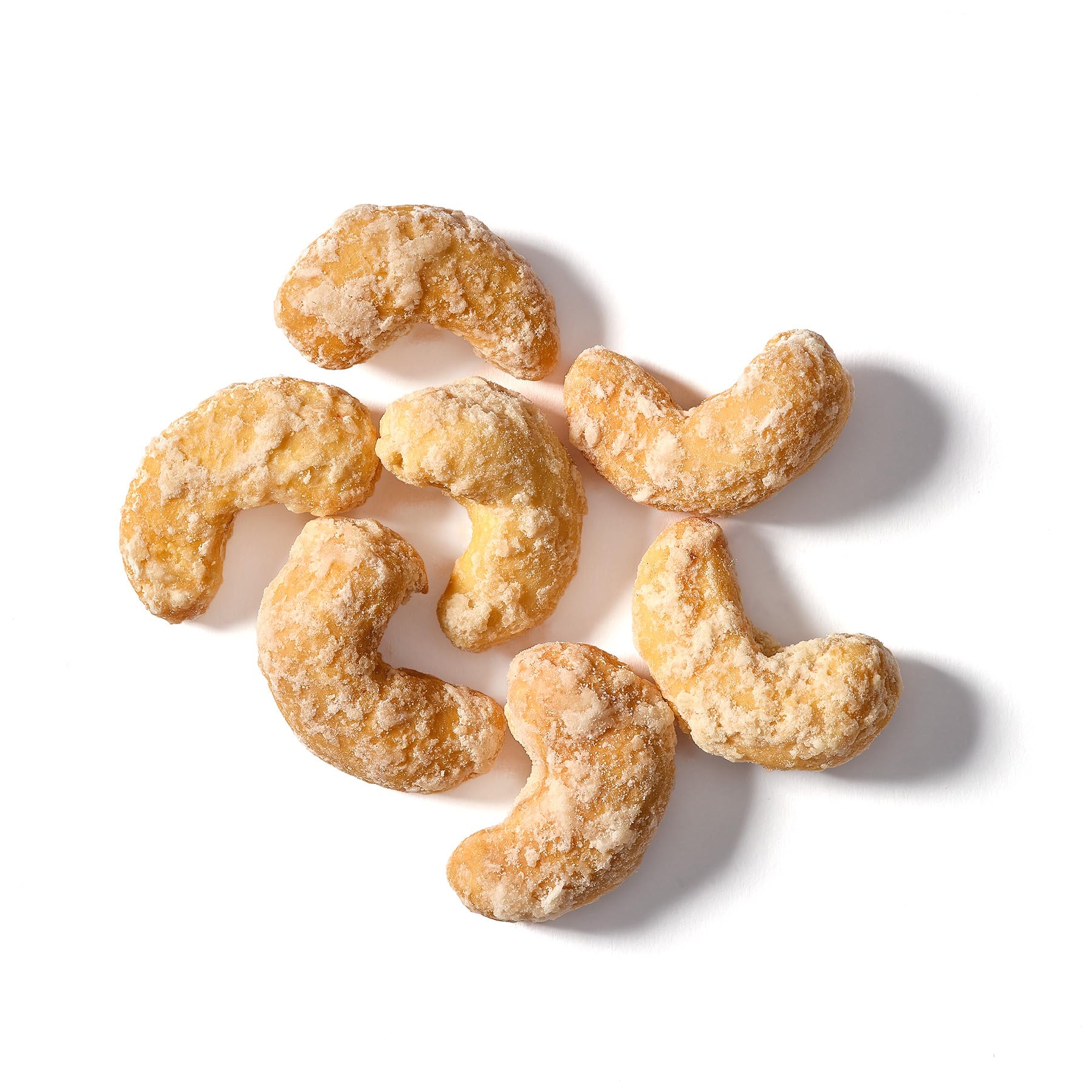 Elan Coconut Cashews coconut powder dusting, tropical aroma enhances snacking.