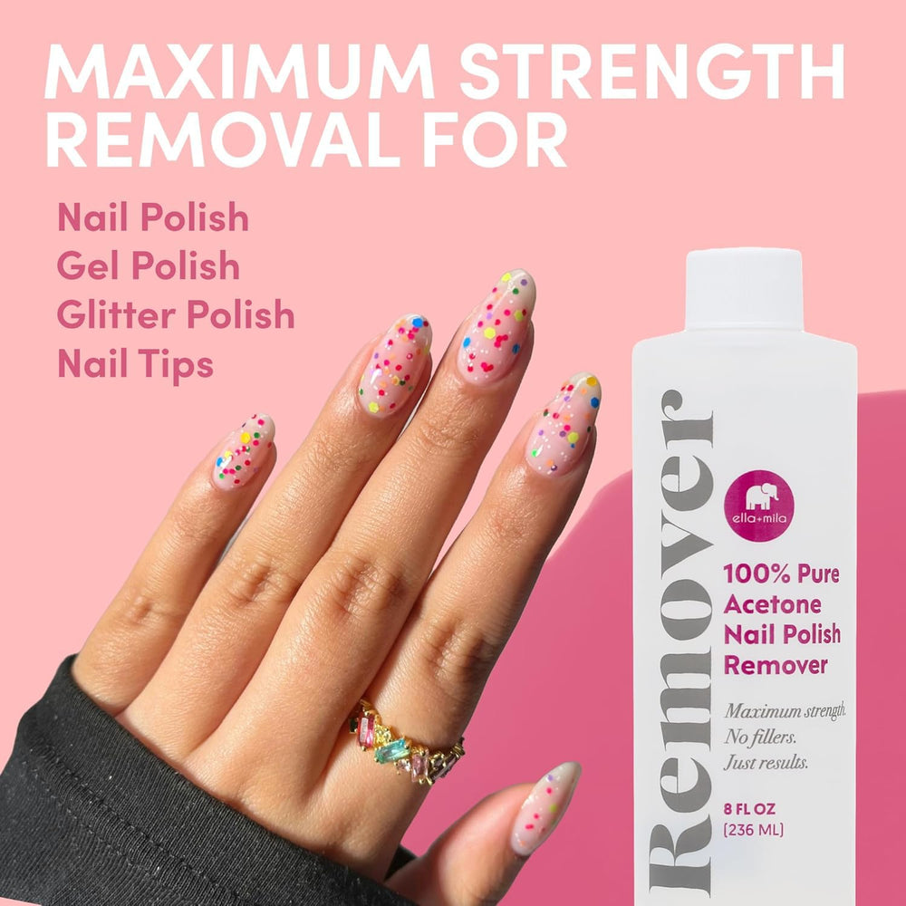 Ella Mila acetone remover with clear glass bottle on workspace.