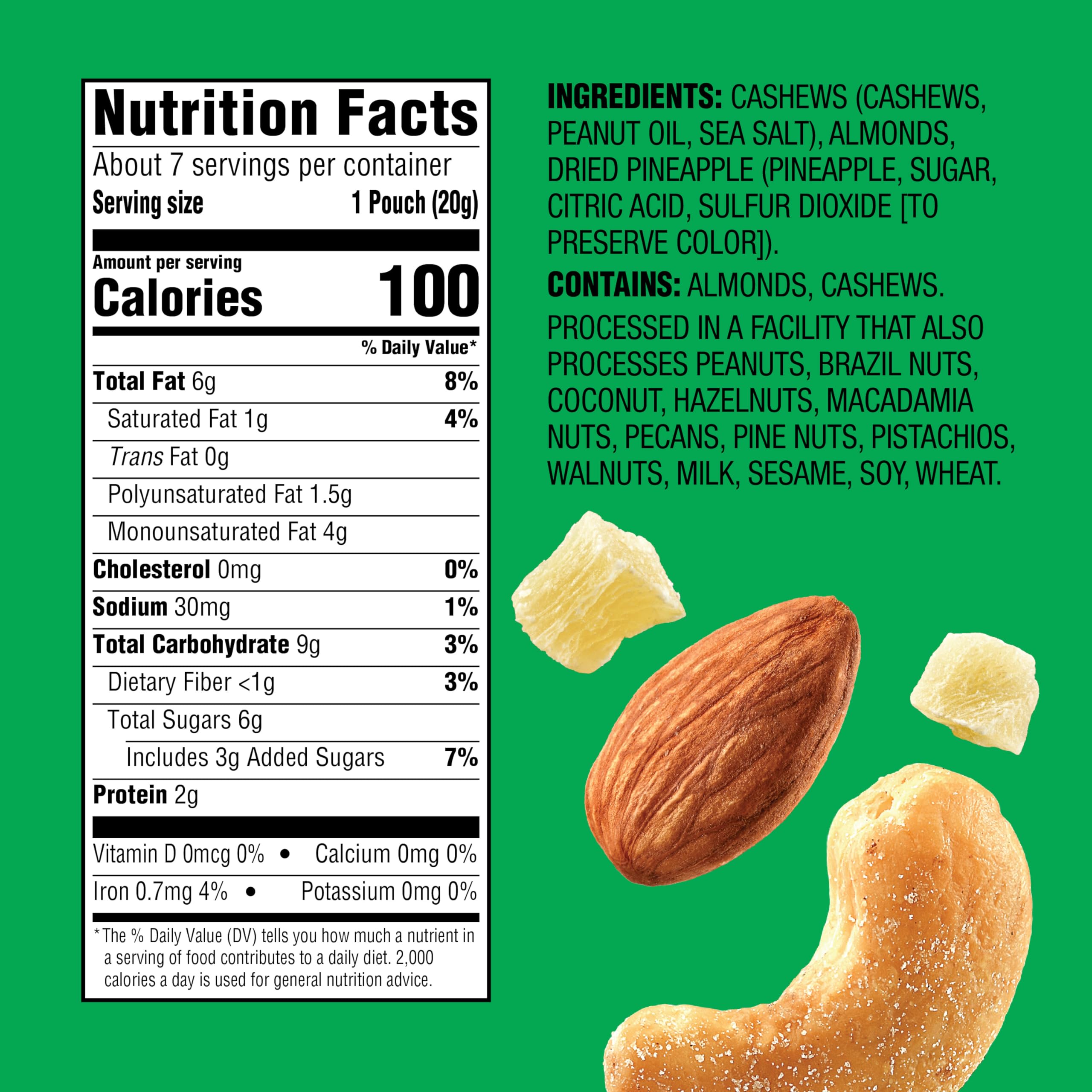 Emerald cashews and almonds with dried pineapple close-up showing crunchy texture