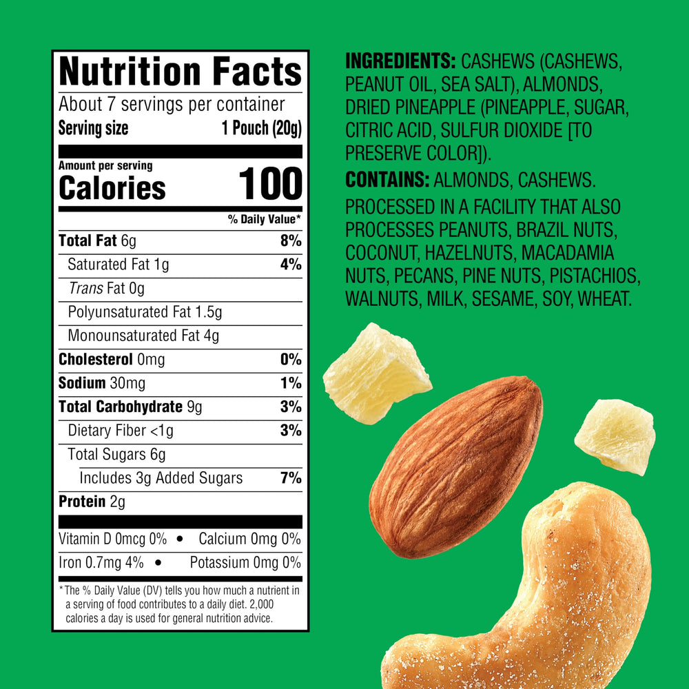 Emerald cashews and almonds with dried pineapple close-up showing crunchy texture