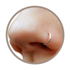 EnCharmed clip-on nose ring in silver, close-up of delicate faux piercing look.