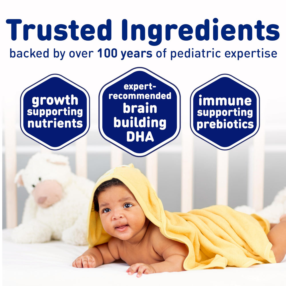 Infant enjoying bottle feed with Enfamil Infant formula.