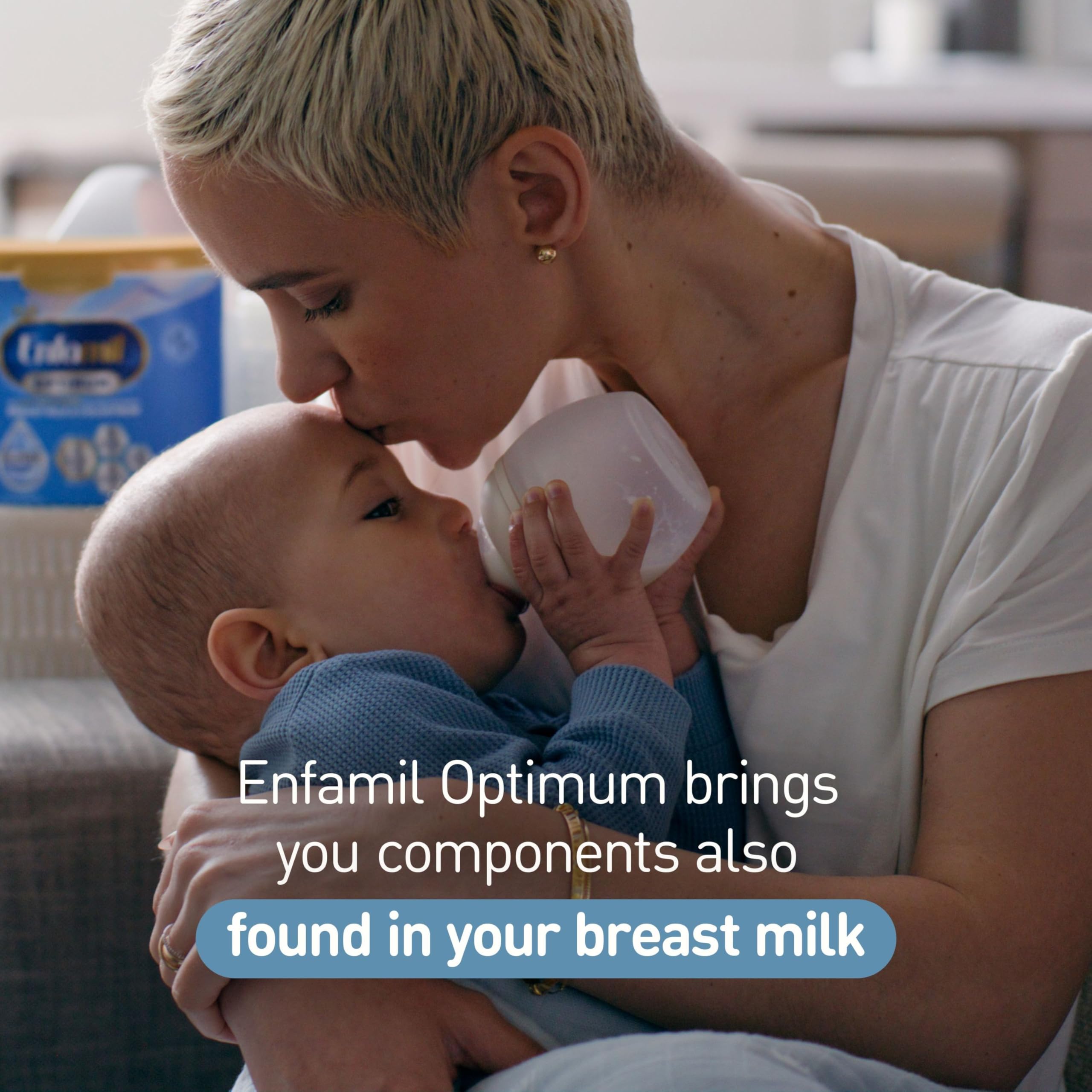 Preparing Enfamil Optimum powder into a bottle at feeding.