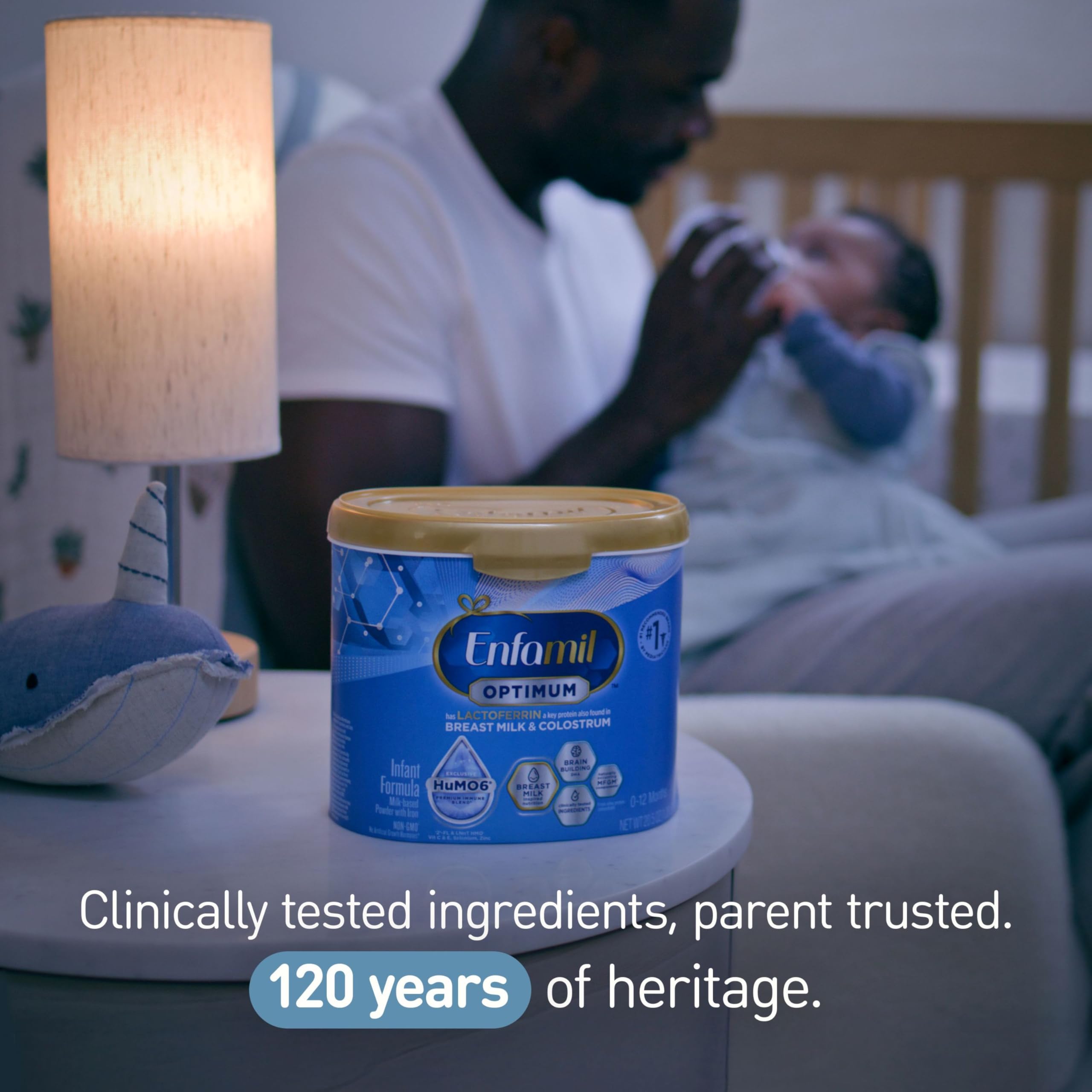Enfamil Optimum US-sourced milk symbol on the label.