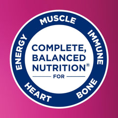 Ensure Complete Strawberry shake being poured into a glass for on the go nutrition