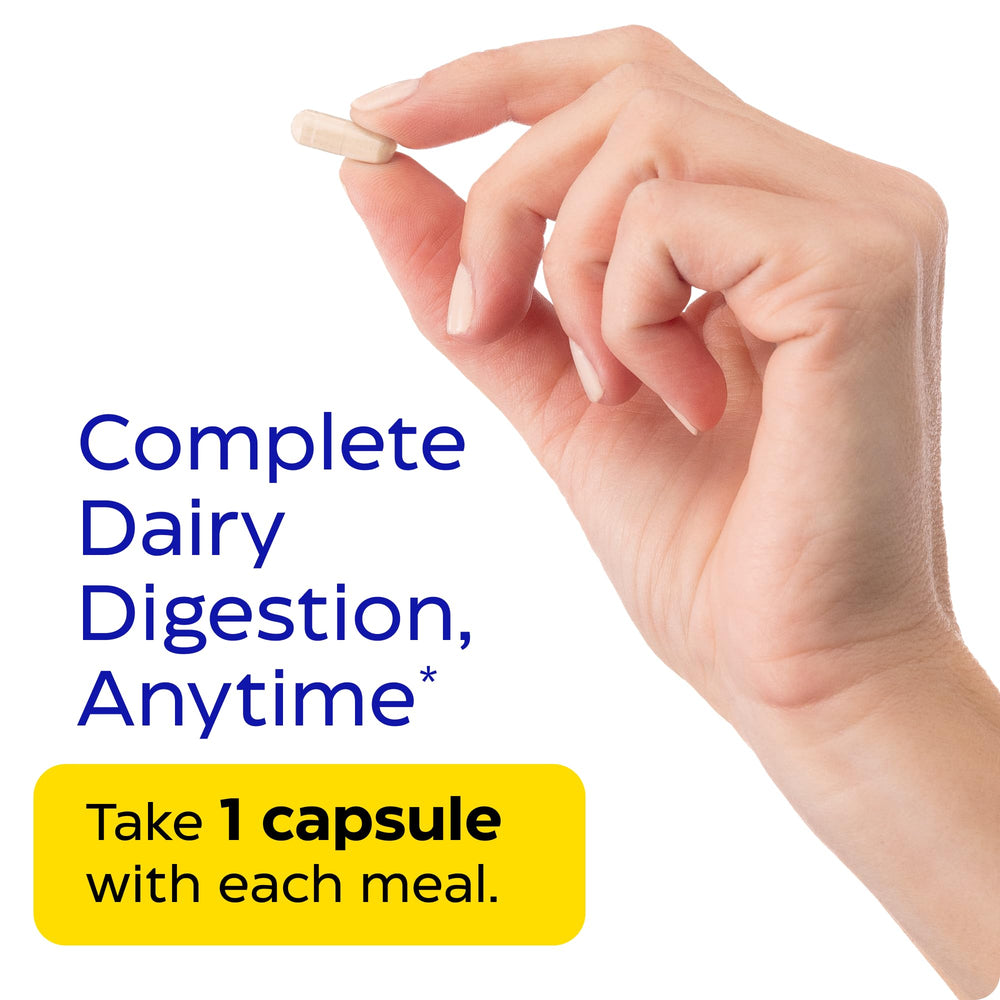 Pills on white surface, daily dairy support ready to take.