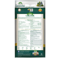 Espoma Evergreen-Tone being applied to evergreens for balanced nutrition.