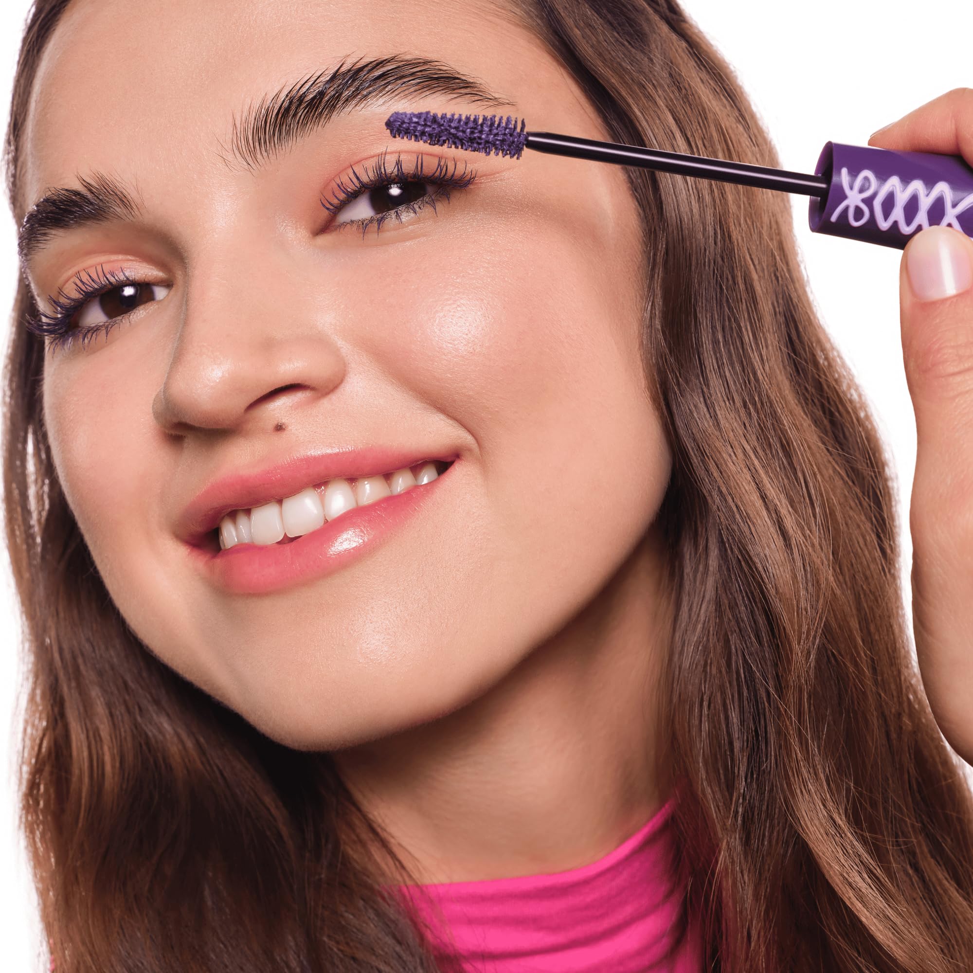 Essence display showing purple mascara color on shelf.