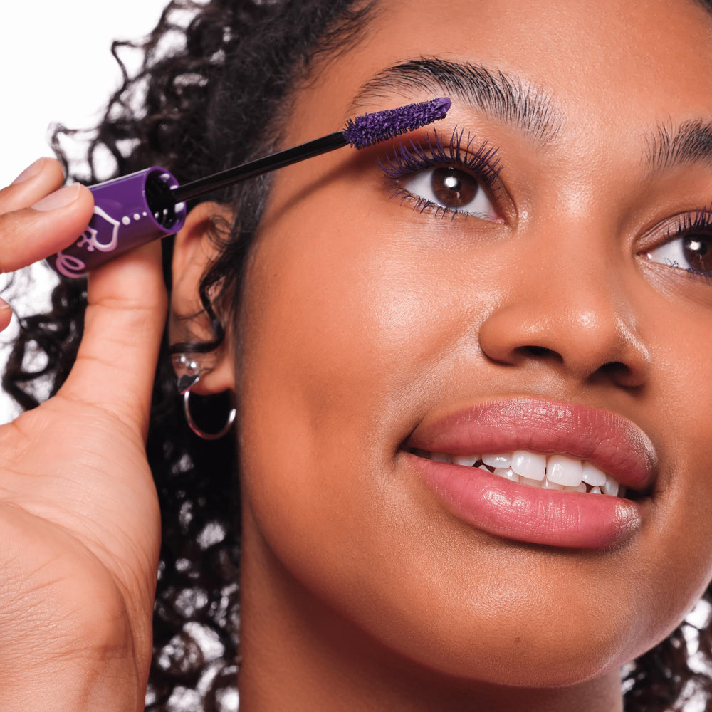 Close-up eye with Essence Lash Princess Purple lashes for color-boosted look.