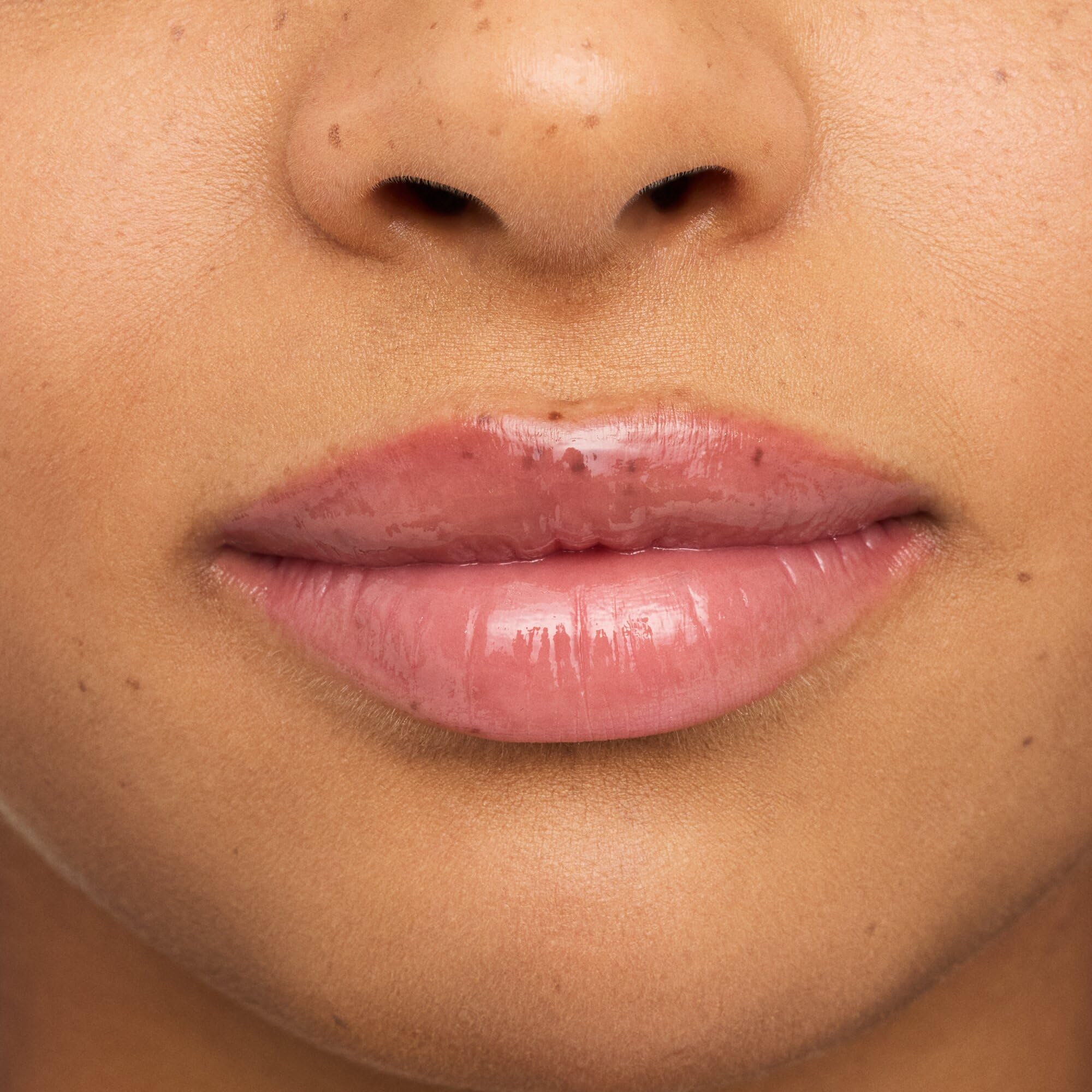 essence milky gloss packaging on display emphasizes a luxe look and glide.