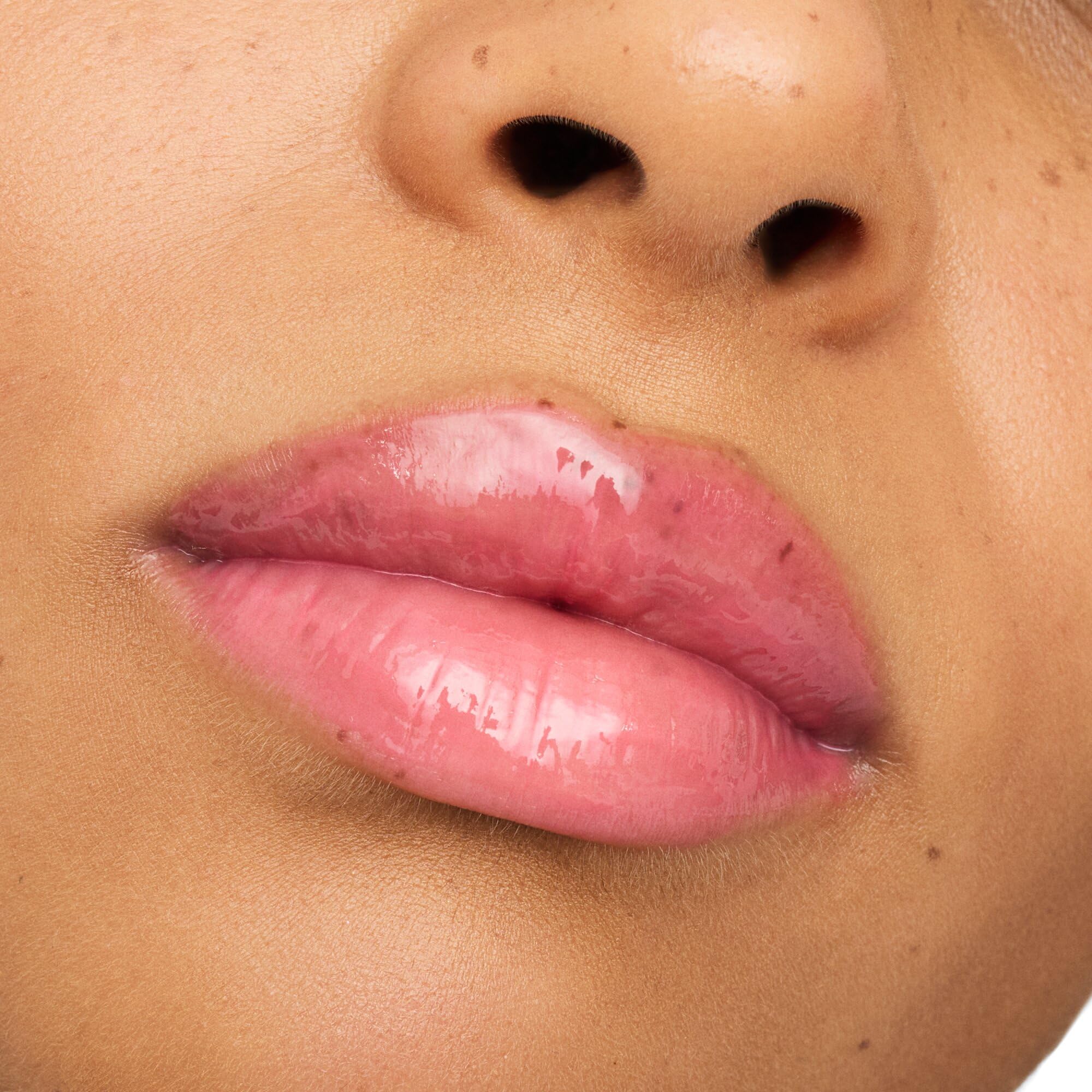 essence Super Peptide Glossy Lip Treatment application visible on lips for glide-on ease