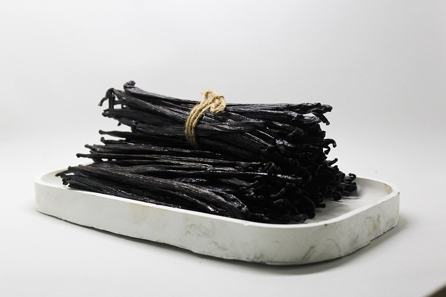 Plump Planifolia vanilla beans with dark brown sheen for culinary uses