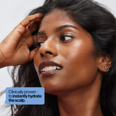 Eva NYC Hydrating Scalp Treatment Serum applied on scalp for moisture delivery
