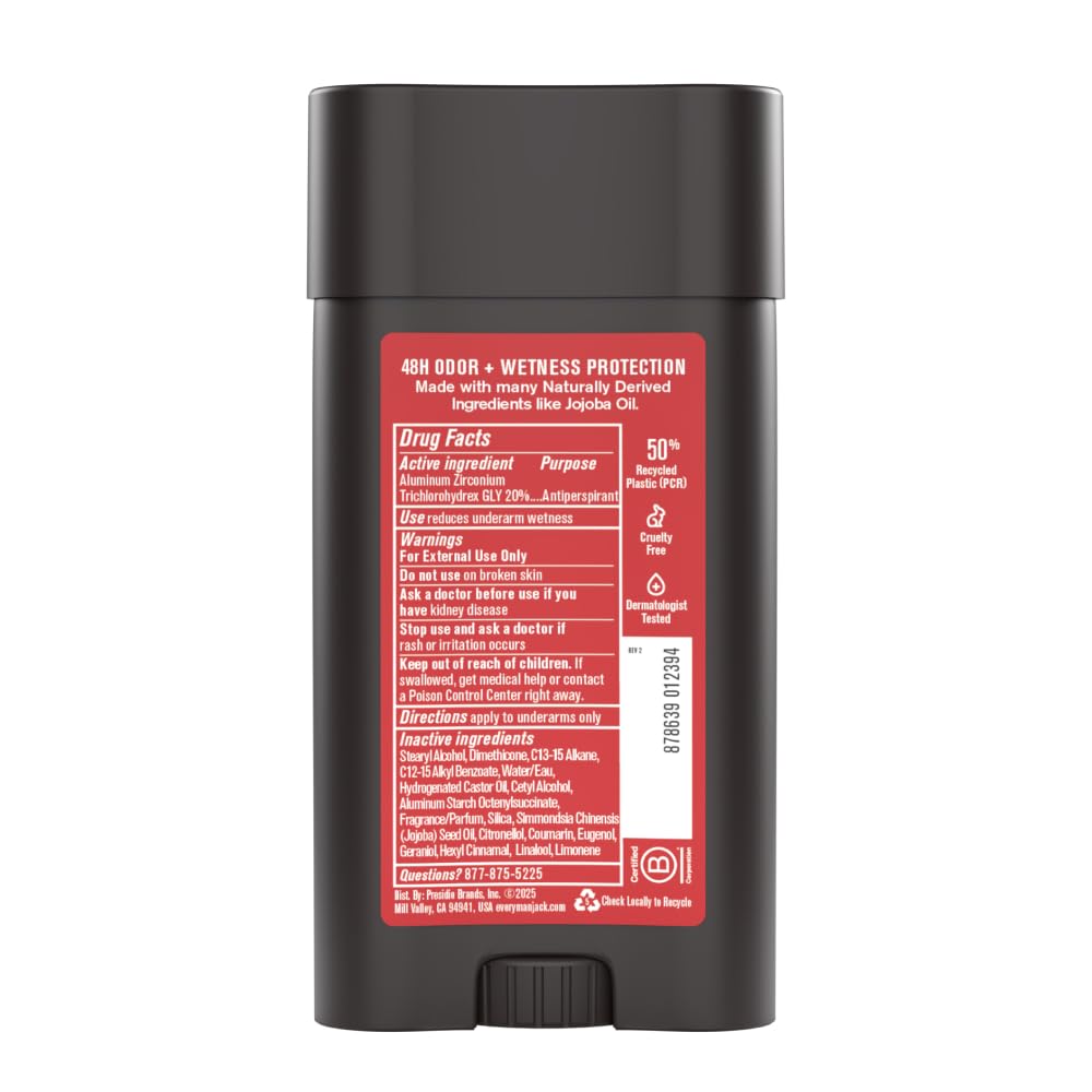 User applying deodorant during morning routine.