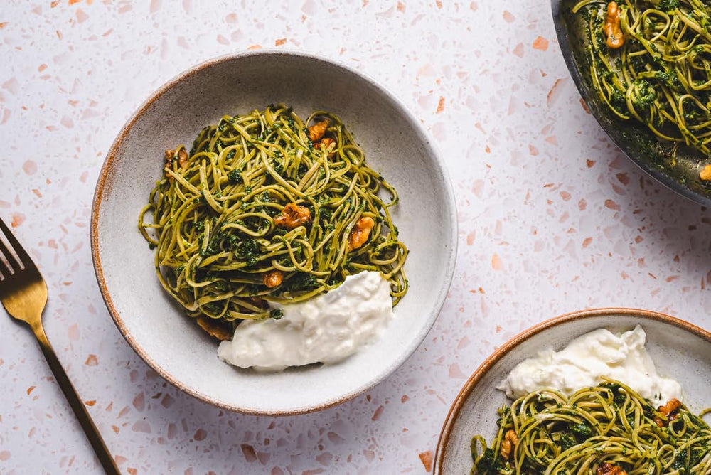 EXPLORE CUISINE Edamame Spaghetti plated with herbs signaling vegan lifestyle option.