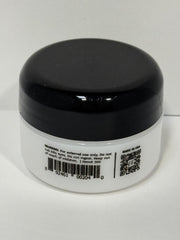 Applying Eye Envy powder around the eye area with the applicator for controlled use.