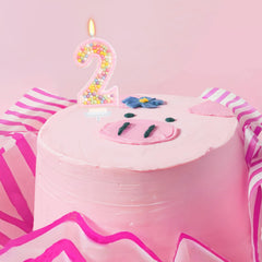 Colorful pearl accents from FAMGift create a sparkling cake centerpiece.