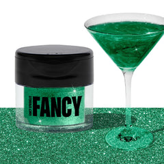 Fancy Sprinkles Emerald Green glitter dusted on dessert for vibrant sparkle.