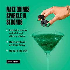 Fancy Sprinkles Emerald Green glitter being poured onto a drink for shimmer.