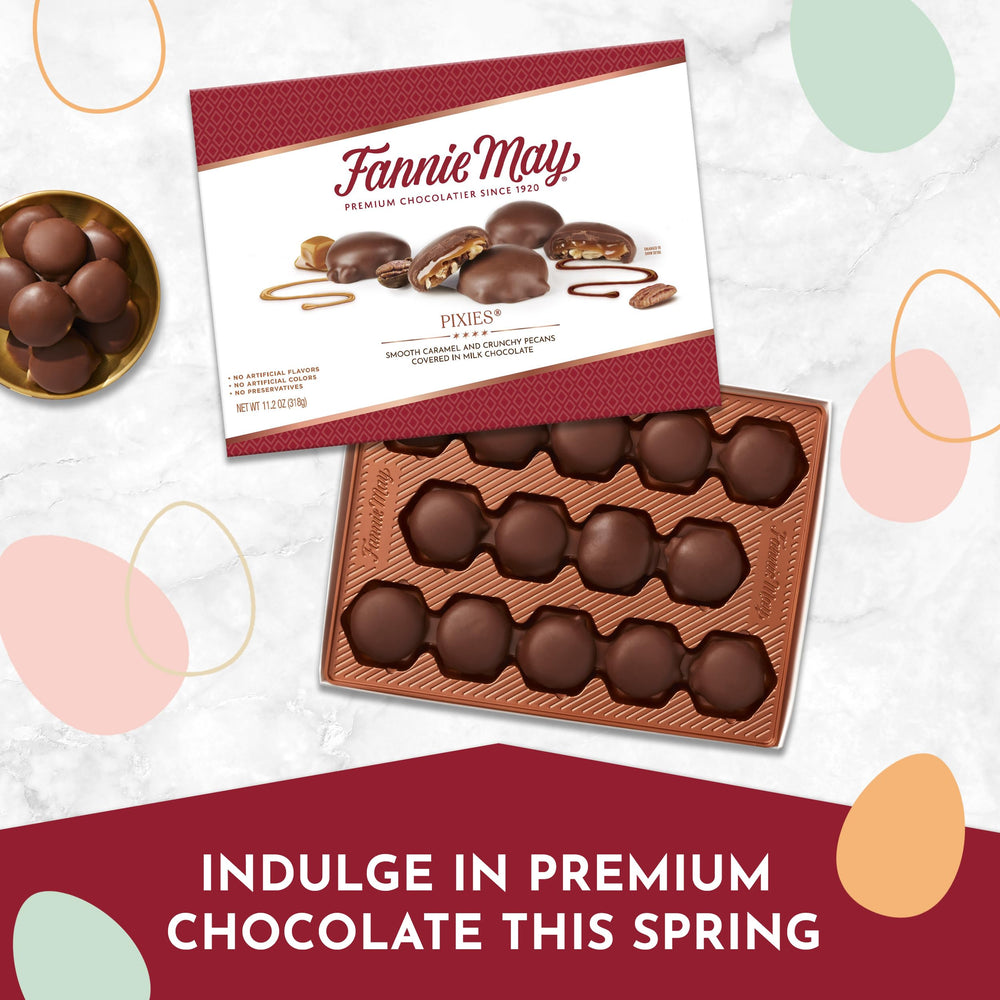 Fannie May Pixies creamy milk chocolate surrounding caramel and pecans.