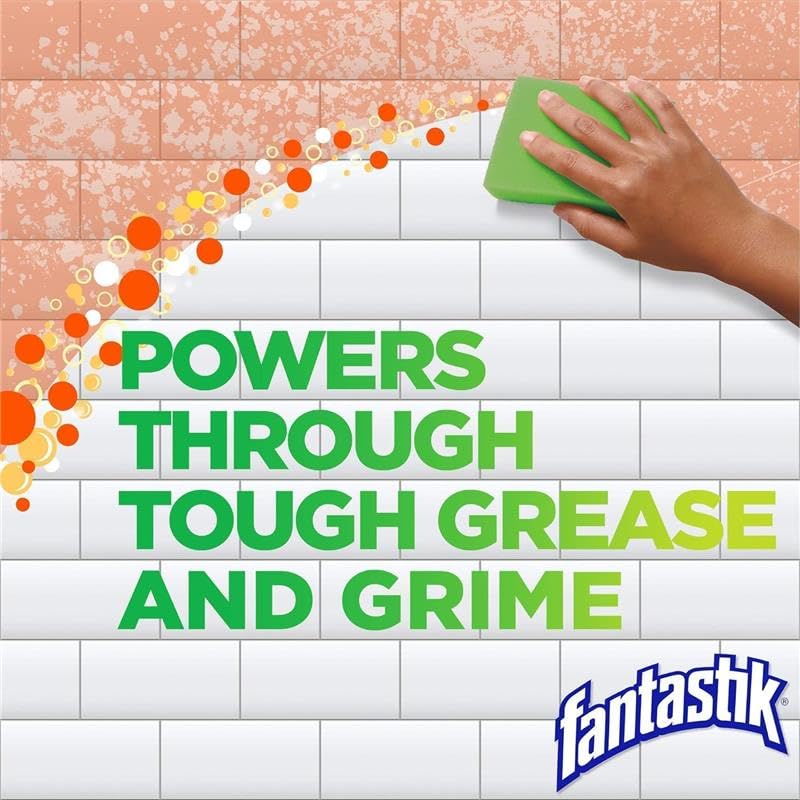 Fantastik Advanced Kitchen Cleaner spray-mist used on a stovetop.