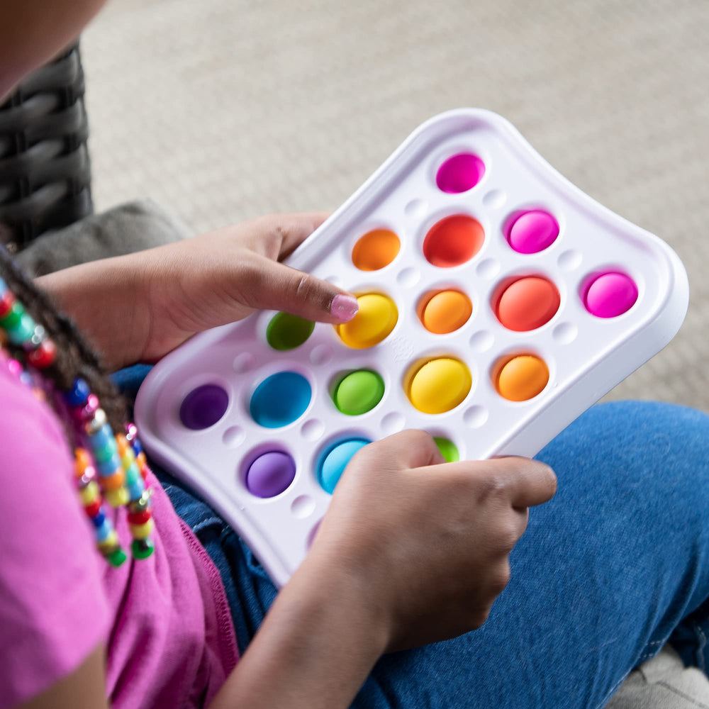 Dimpl Pops features two bubble sizes for varied play and fine motor practice.