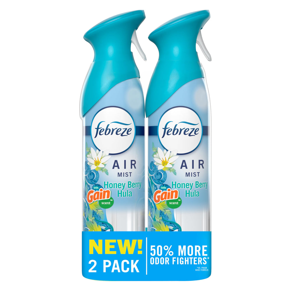 Febreze Air Mist Gain Honey Berry Hula bottle releasing fresh tropical aroma for any room