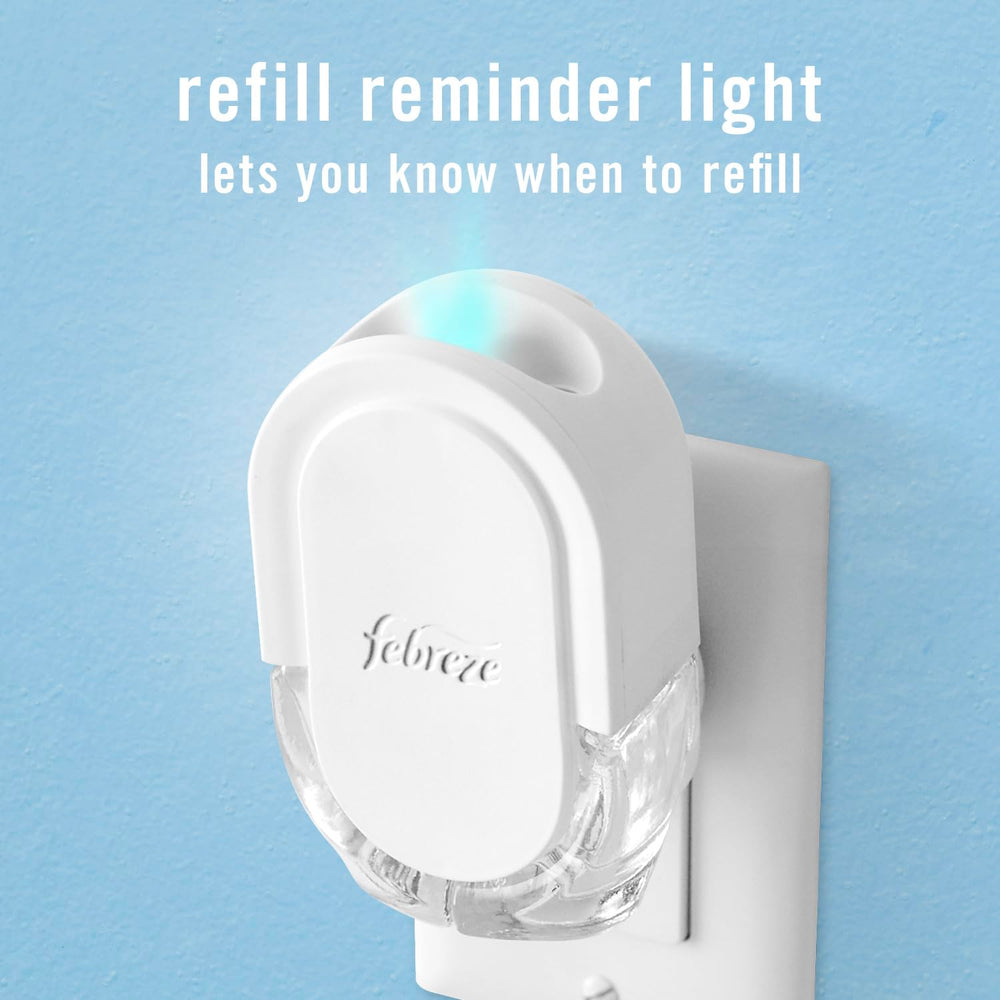 Febreze Plug air freshener unit shown in a cozy living space