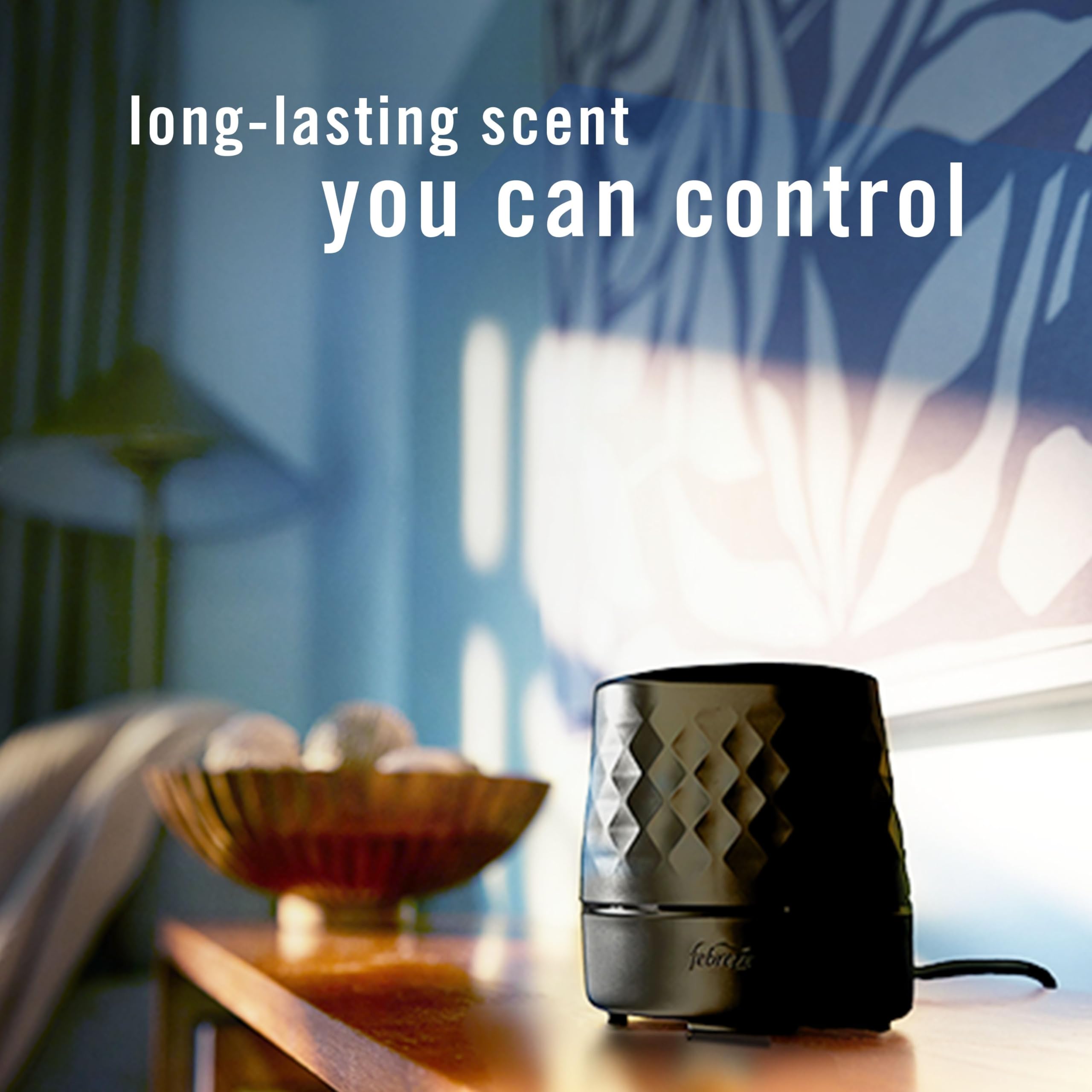 Close-up of Boost button on Febreze Plug Scent Booster for a 40-minute scent boost.