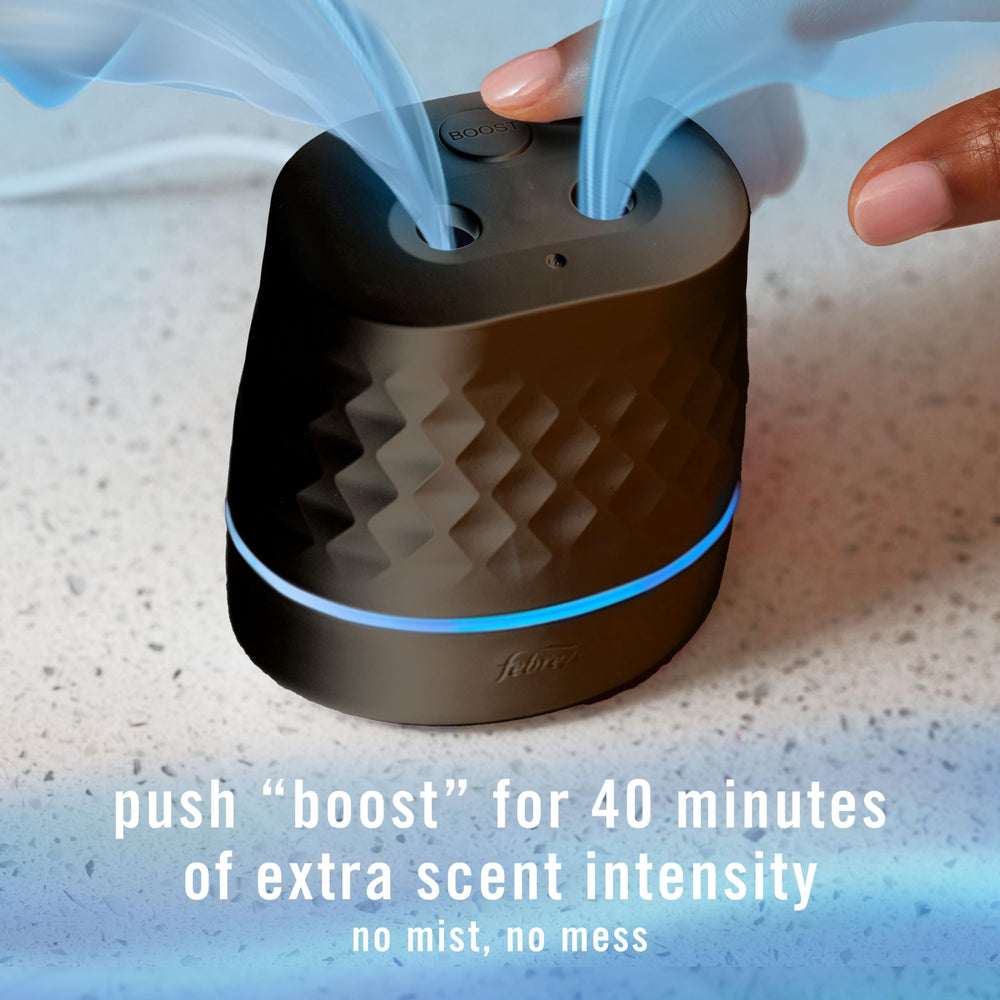 Intensity control slider on Febreze Plug Scent Booster for tailored fragrance.