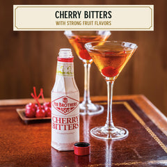Pouring Fee Brothers Cherry Bitters to balance a whiskey-based cocktail.