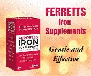 Ferretts Iron Tablets pouring from bottle into a glass.