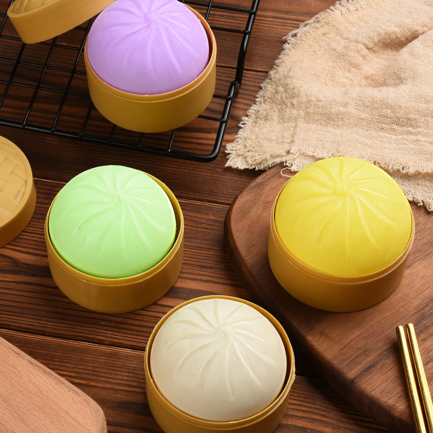FFNIU hand-squeeze demo showing compact 2-inch dumpling stress ball