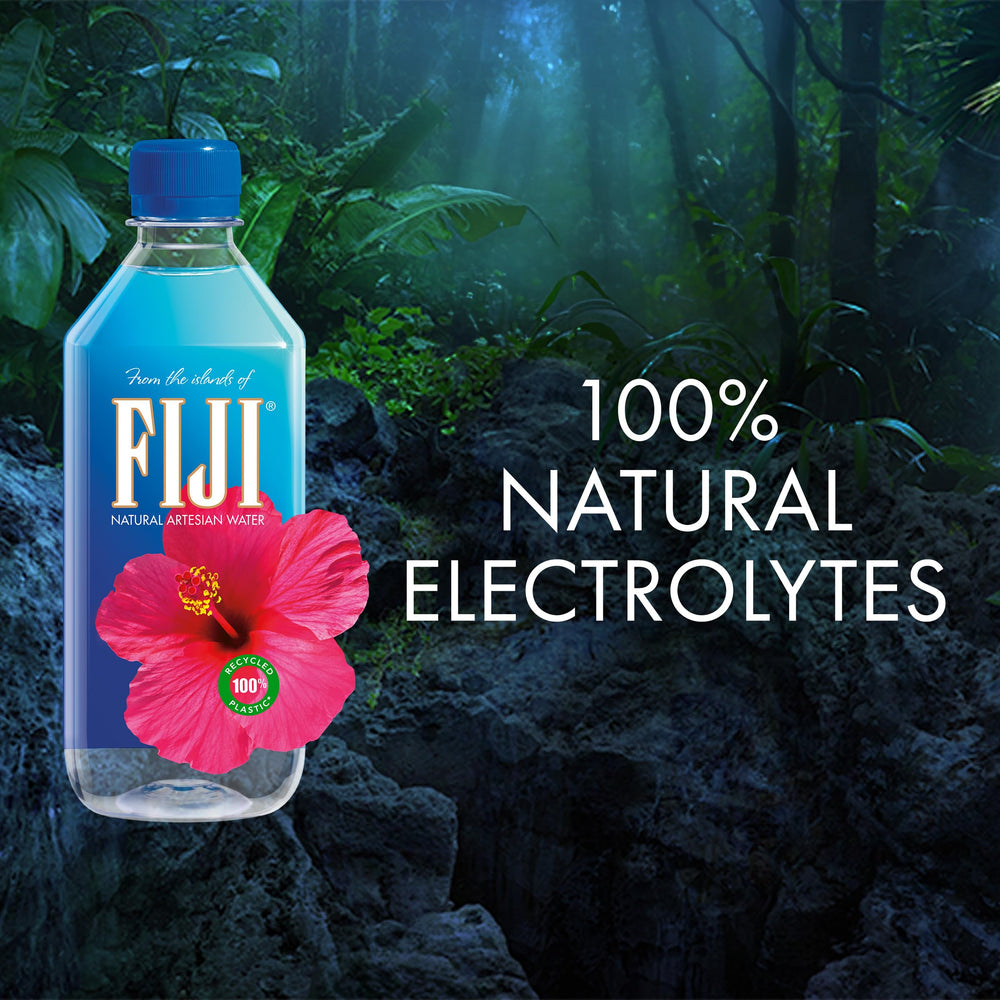 FIJI Water bottle in gym setting emphasizes refreshing post-workout hydration.