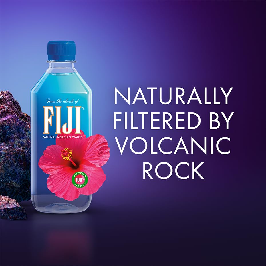 FIJI water travel-friendly bottle beside luggage for easy sightseeing hydration.