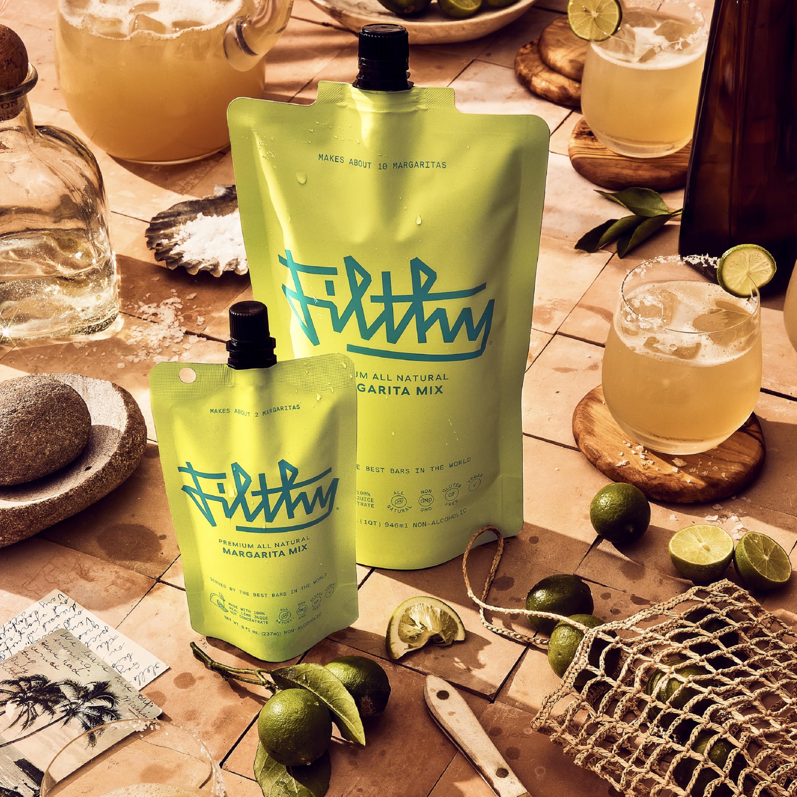 Filthy Food margarita mix being poured into a glass for a refreshing margarita