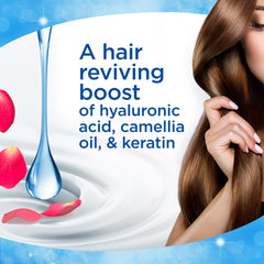 Finesse Restore Strengthen conditioner on hair texture after use showcasing smoothness.