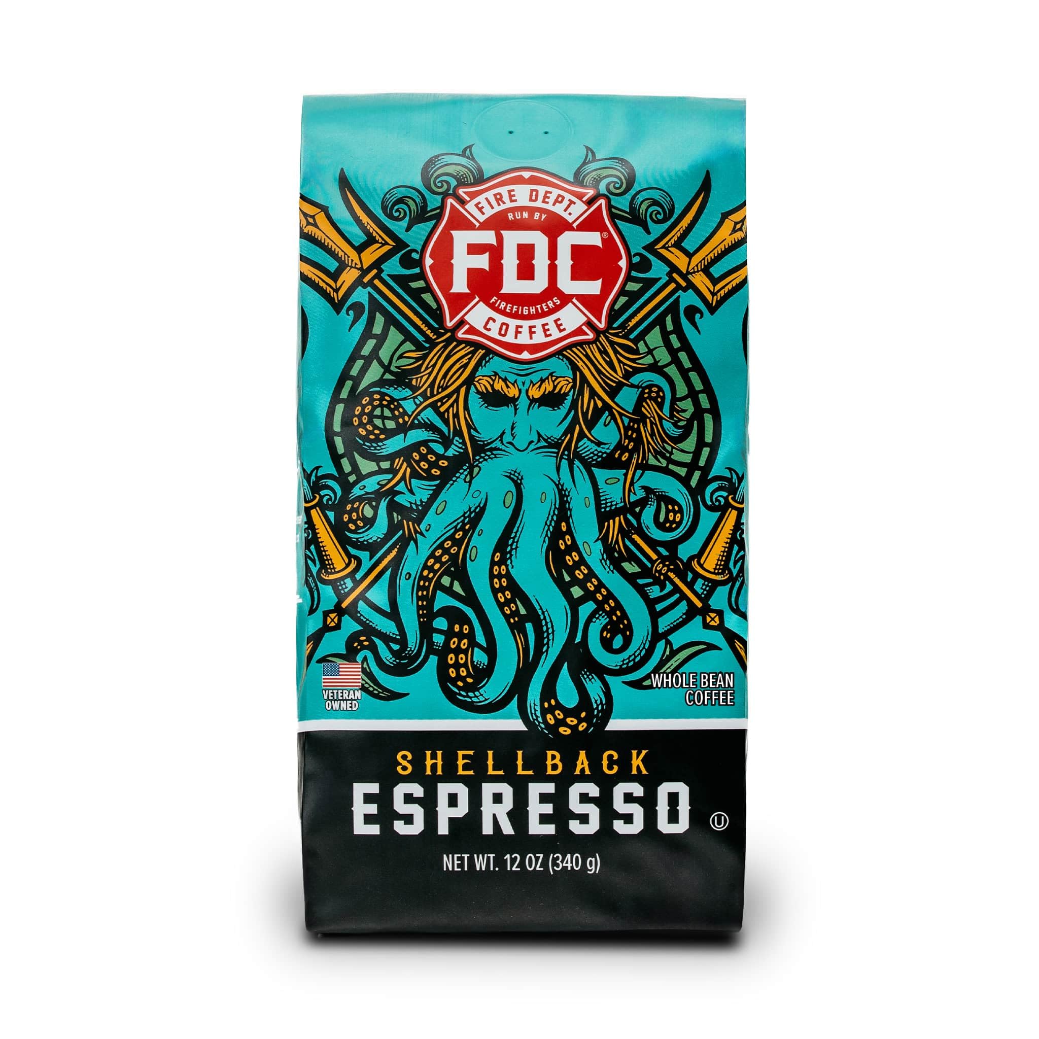 Fire Department Coffee Shellback Espresso beans on table, bold aroma for morning wake-up.