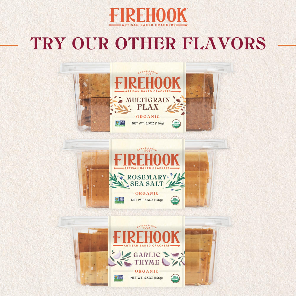 Firehook crackers beside smoked salmon on a board for savory pairing.