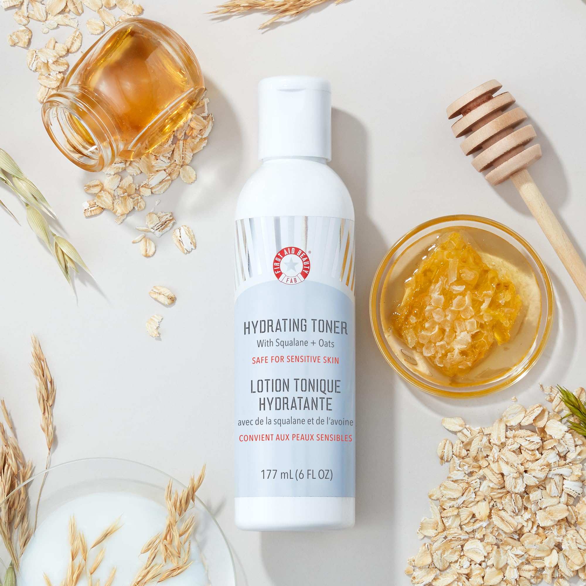 Close-up of First Aid Beauty Hydrating Toner texture shows a milky, soothing formula.