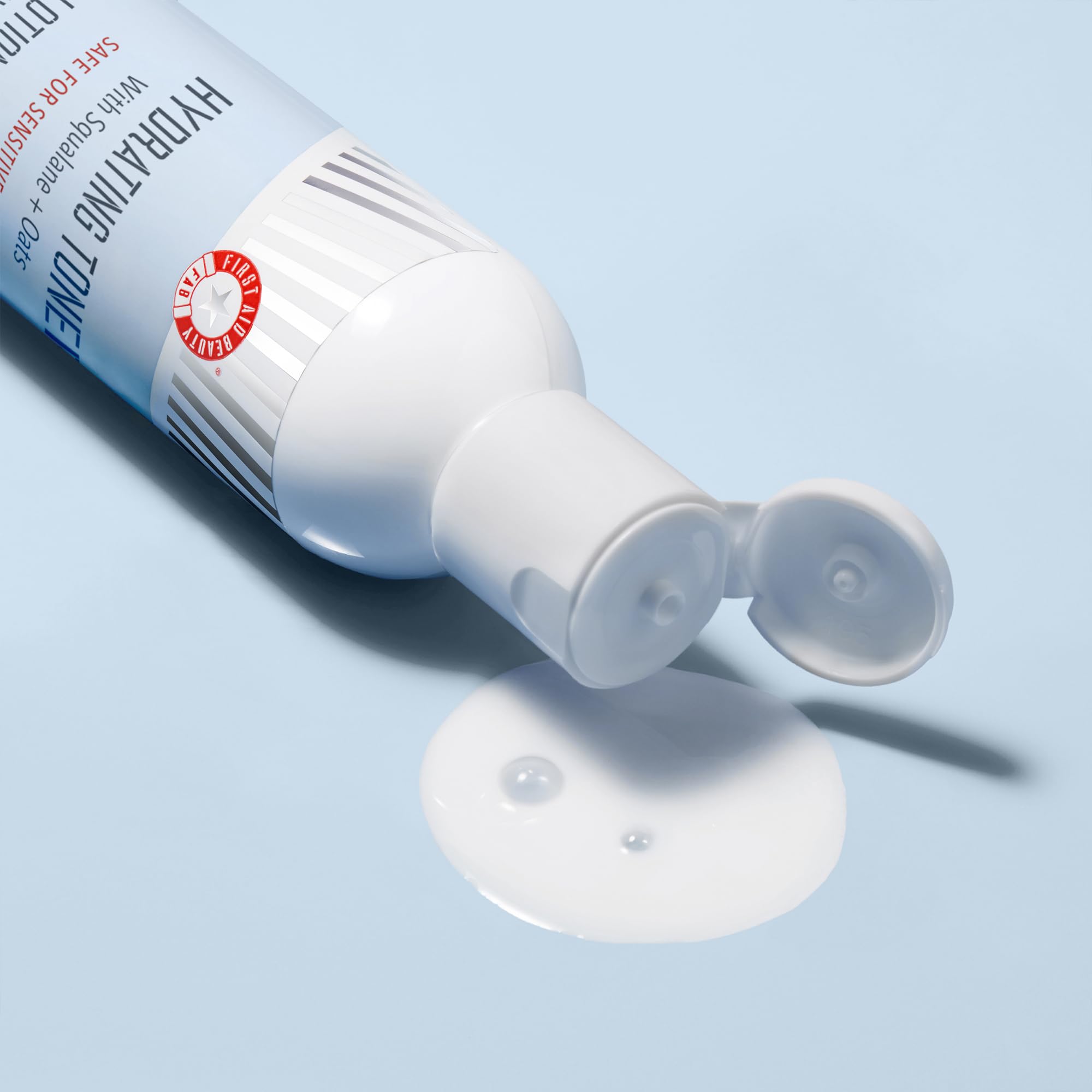 Application on the face with First Aid Beauty Hydrating Toner ready to be absorbed.