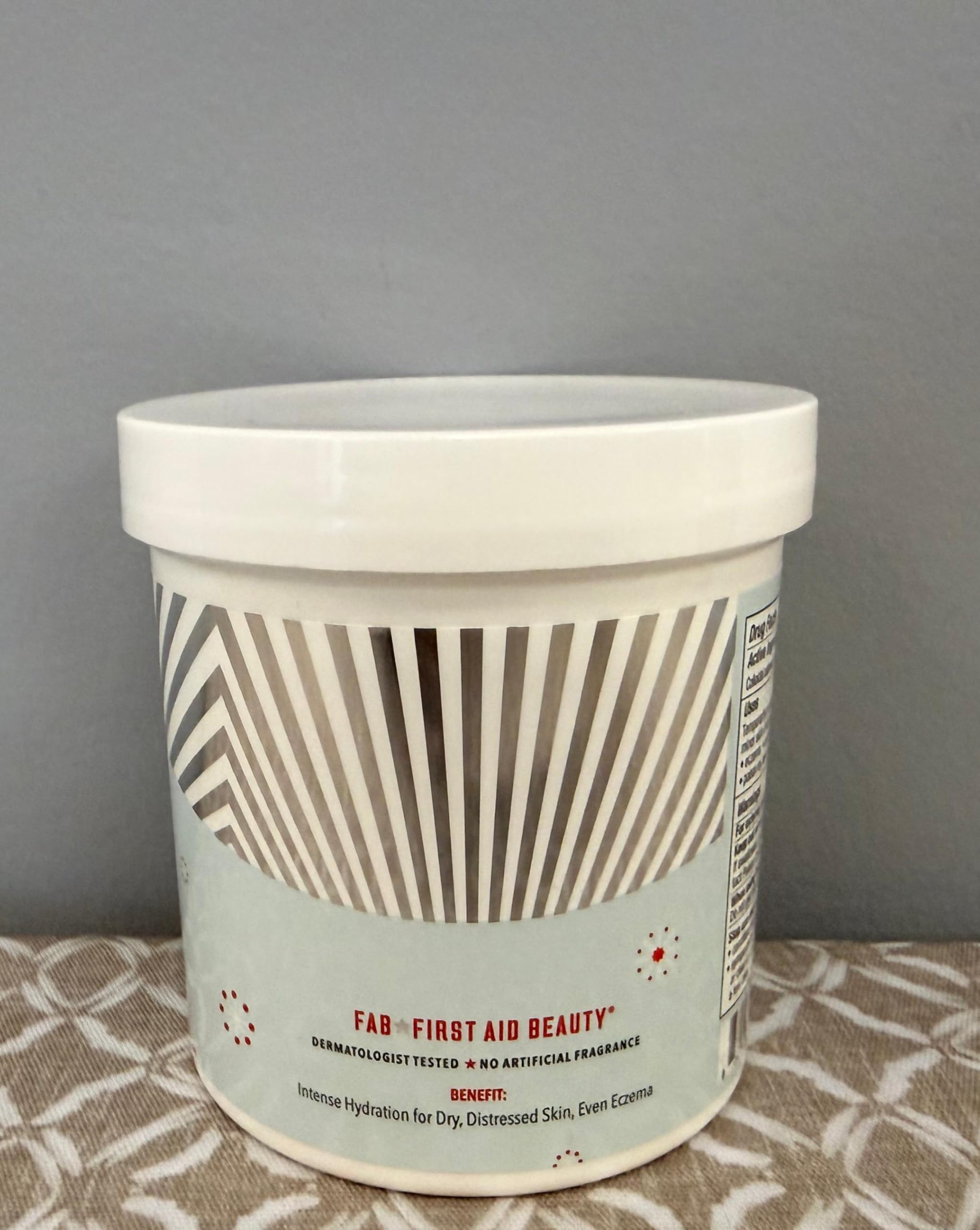 First Aid Beauty Ultra Repair Cream application frame signaling nourishing barrier support.