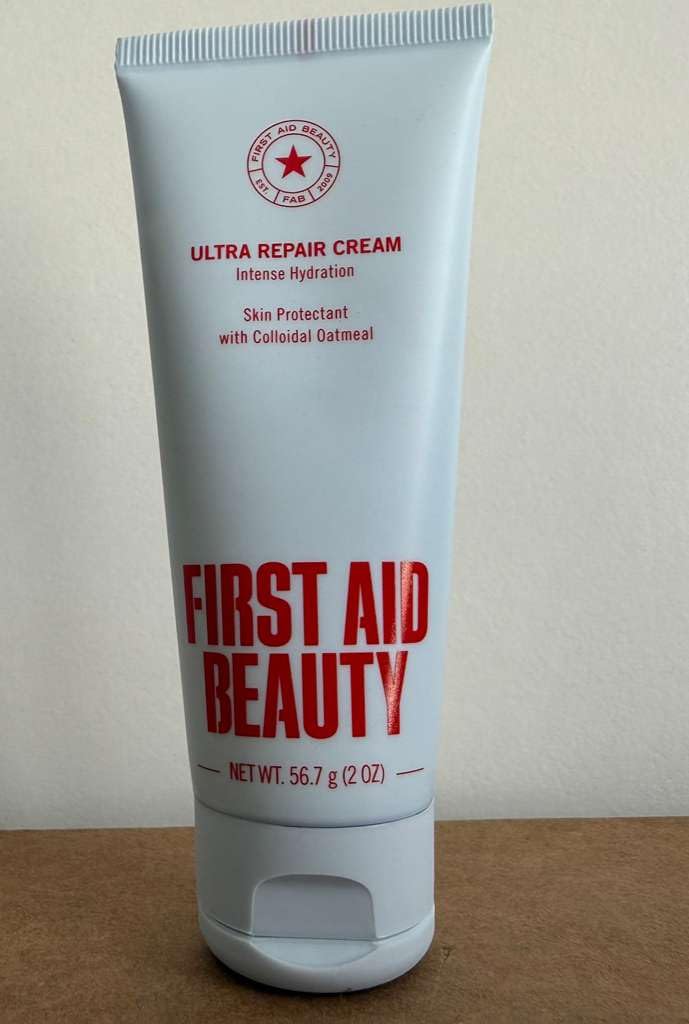 First Aid Beauty Ultra Repair Cream being applied to both face and body in routine