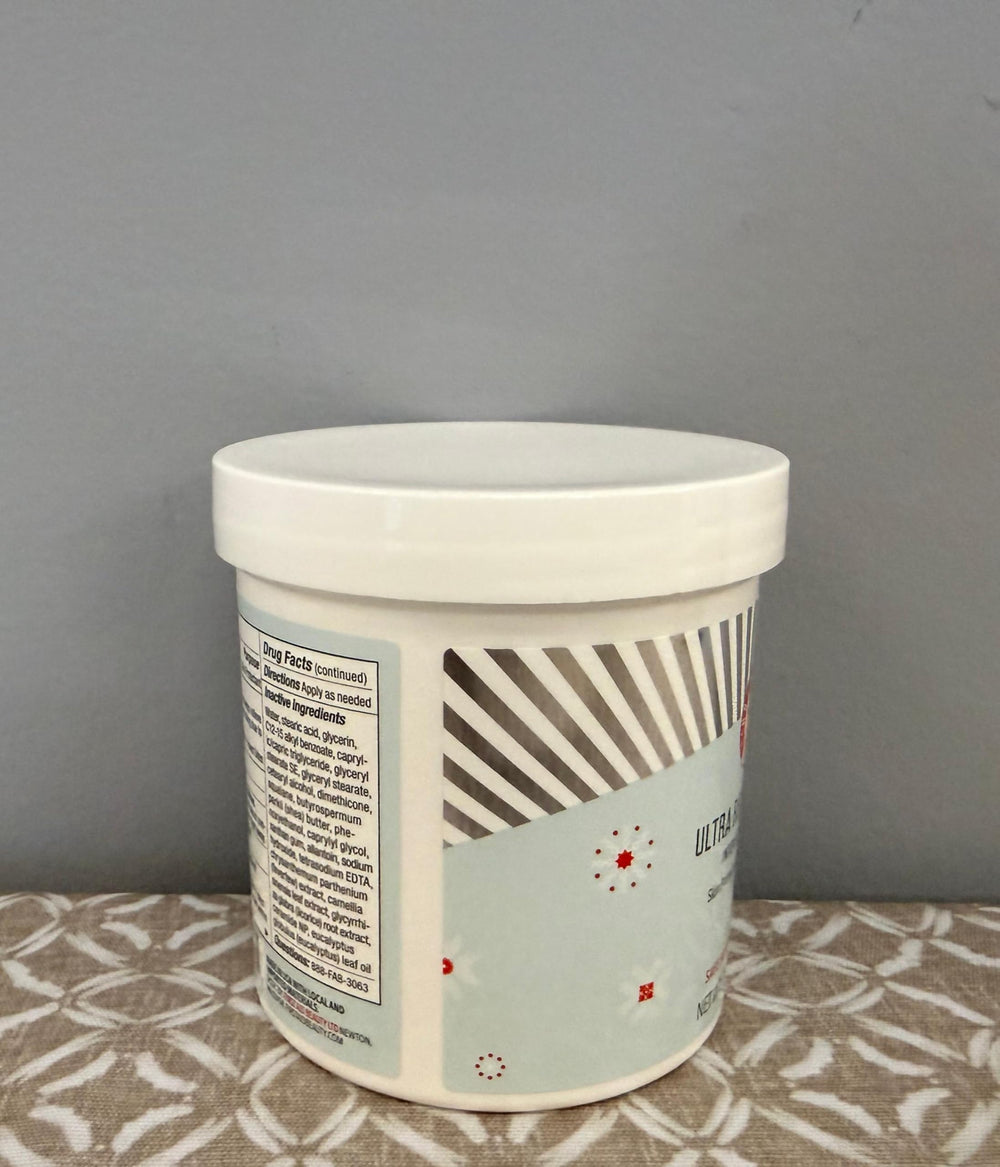First Aid Beauty Ultra Repair Cream on bathroom shelf for daily skincare routine.