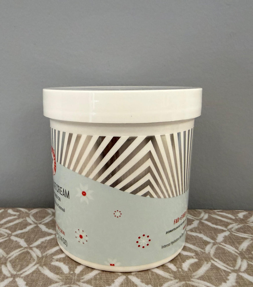 First Aid Beauty Ultra Repair Cream packaging on shelf signals barrier support.
