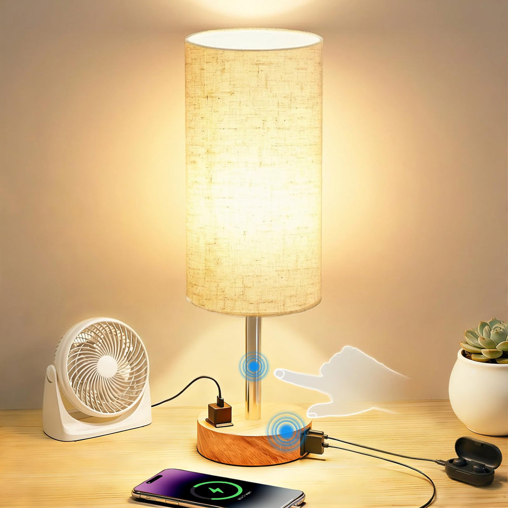 Fitfull table lamp with AC outlet and USB-C port powers bedside devices.