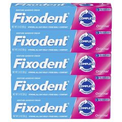 Fixodent Original strong hold adhesive applied to dentures for long wear.