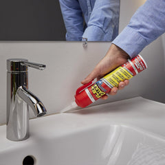 Flex Seal caulk outdoor window frame provides waterproof seal.