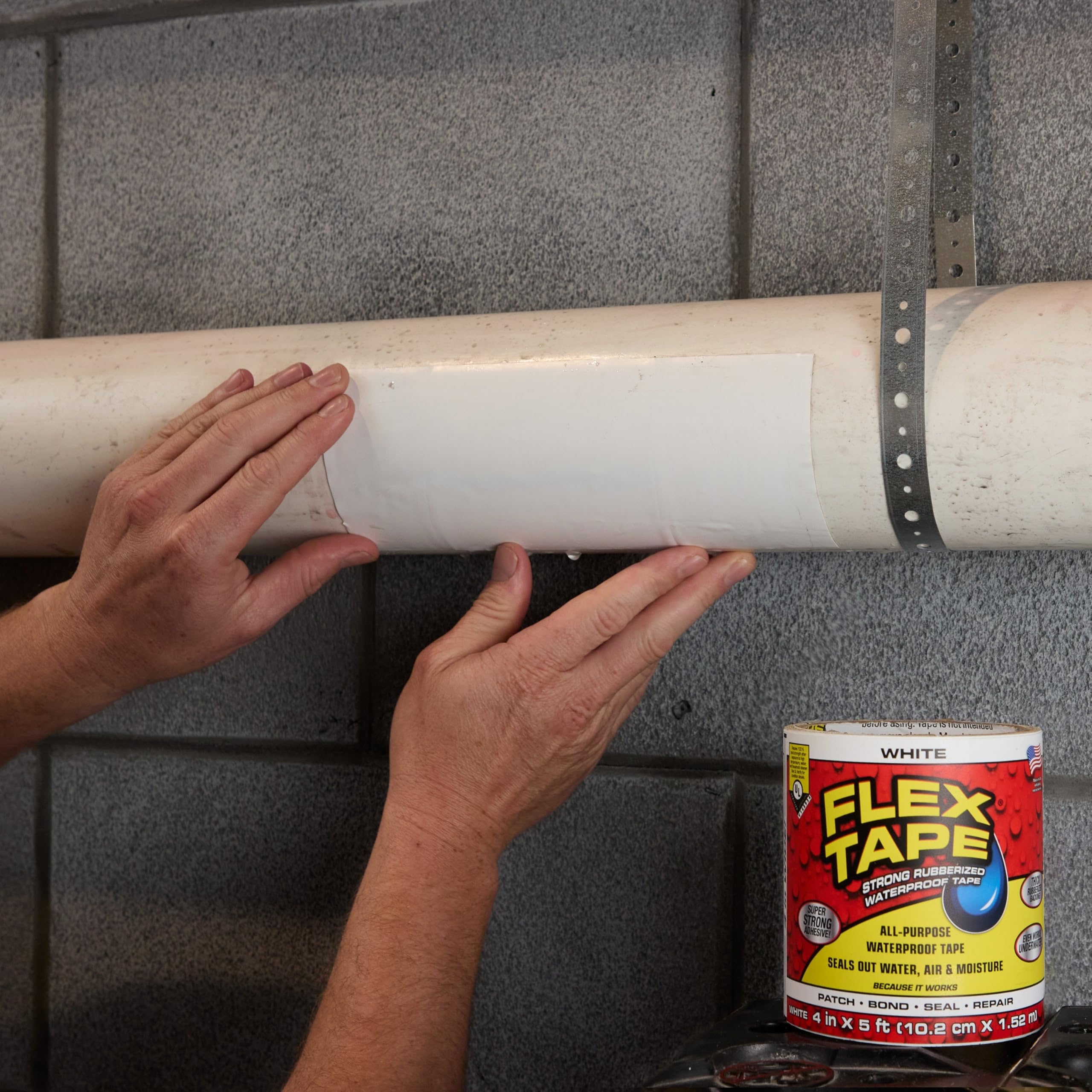 Flex Tape on a roof demonstrates firm adhesion across uneven shingles.